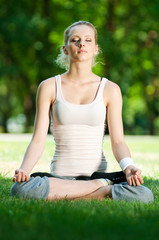 Young woman doing yoga exercise