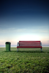Fototapeta premium Bench in the park at the seashore