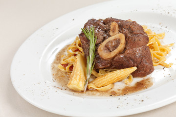 tasty steak with pasta