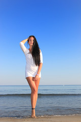 Fototapeta na wymiar Attractive girl on the beach