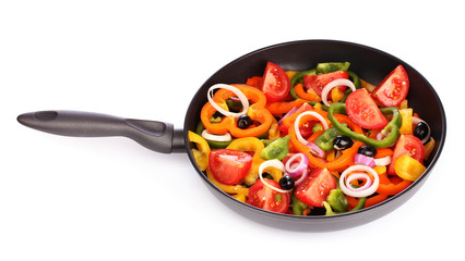 sliced ​​vegetables in a pan isolated on white