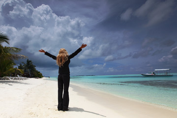 happy business woman on the ocean coast