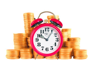 Red alarm clock with golden coins over white background