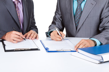 Two business people working with documents sign up contract