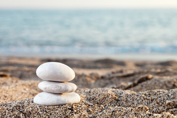 Fototapeta na wymiar Stack or pile of balancing stones on sea beach