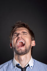 emotional business man man over gray background