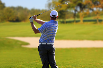 Man playing golf