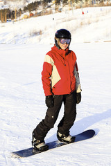 Fototapeta na wymiar Female snowboarder on the snowhill
