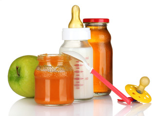 juice, baby bottle and pacifier isolated on white