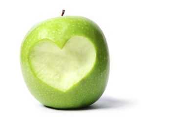 Green apple with cut off heart shape.