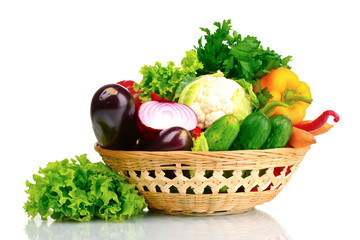 Fresh vegetables in basket isolated on white