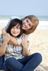 Fototapeta na wymiar Two girls at outdoor near sea