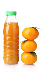 Tangerines and juice bottle isolated on white