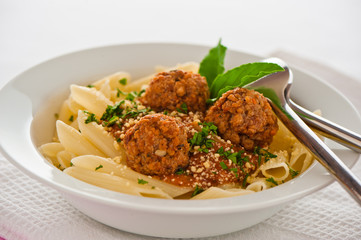 Pasta with tomato garlic sauce and meatballs