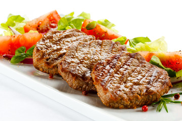 Grilled steaks and vegetables