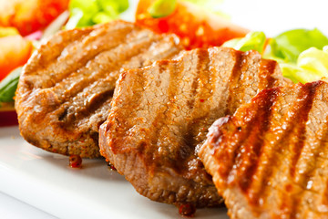 Grilled steaks and vegetables