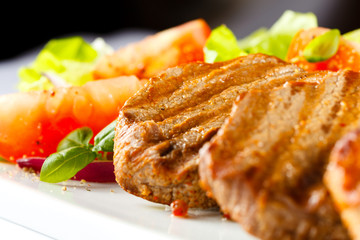 Grilled steaks and vegetables
