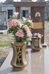 silk flower vase on  graveyard