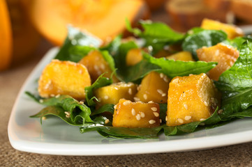 Baked pumpkin, spinach and sesame salad