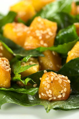 Baked pumpkin, spinach and sesame salad