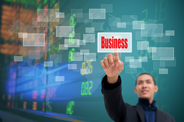 business man pressing a touchscreen button