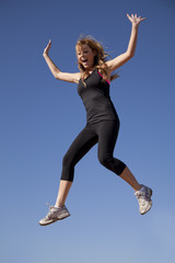 woman black clothes jumping