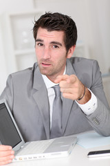 Fototapeta premium Businessman showing something on laptop computer