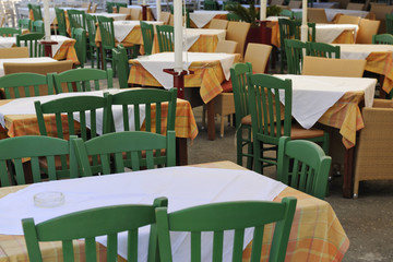 Restaurant terrace with green chairs in Chania - 36086107
