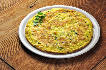 Italian omelette with parsley and parmesan cheese