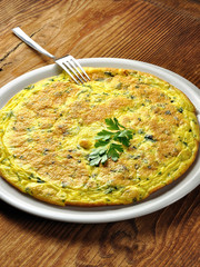 Italian omelette with parsley and parmesan cheese