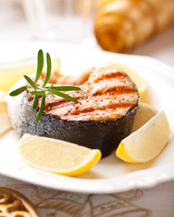 Grilled salmon steak with lemons for Christmas