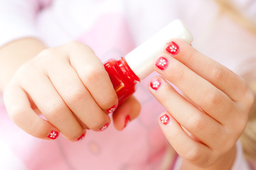 Beautiful hands with red manicure holding tulip - 36091523