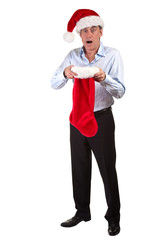 Man in Santa Hat shocked at contents of Christmas Stocking