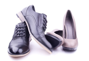 A pair of men's and women's shoes, isolated