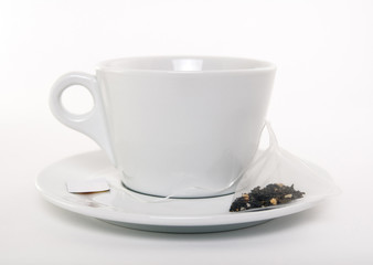 White cup of tea and teabag