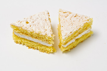 Two triangles of sponge cookies with skimming filling