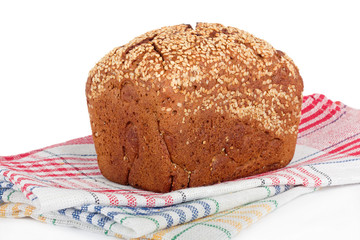 Baked rye bread with linseeds on the white isolated background