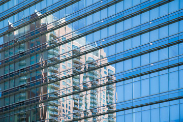 Obraz na płótnie Canvas Reflection of building in windows