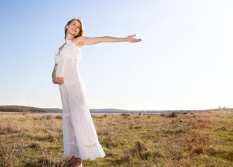Pregnant woman standing on field