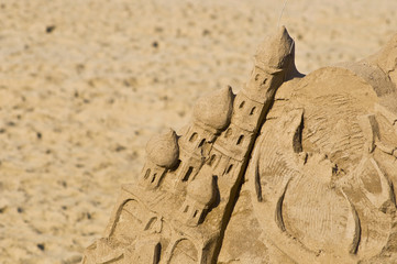 Fototapeta na wymiar Sand castle. On the beach, close-up.