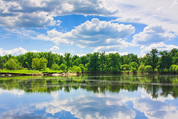 Fototapeta na wymiar Clouds reflection on lake.