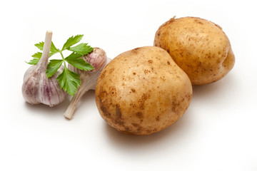 Potato, garlic and parsley isolated on the white background
