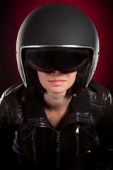 Fototapeta na wymiar Biker girl in a helmet