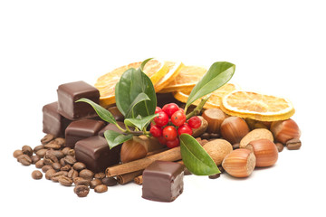 Obraz na płótnie Canvas chocolate, coffee beans, cinnamon, nuts and orange