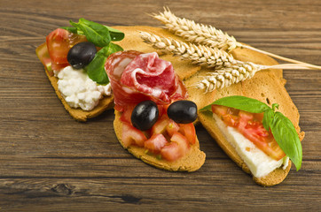 Delicious bruschetta appetizer on wood