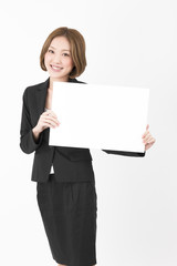 Naklejka premium Beautiful business woman with white board