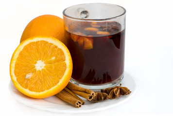 Christmas hot wine with oranges over white background