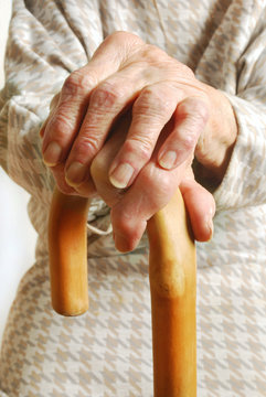 Old Lady's hands with walking stick
