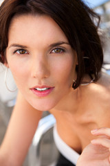 Naklejka premium Portrait of pretty young businesswoman sitting outdoor at cafe a