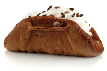 Cake with whipped cream and chocolate chips.